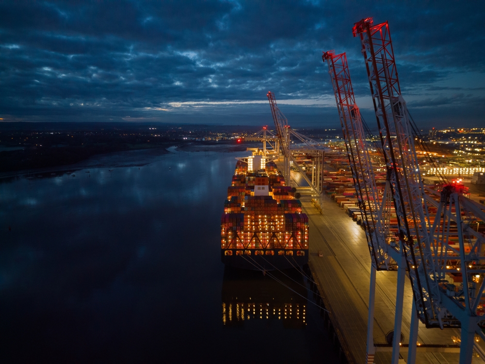 Illuminated,Container,Ship,And,Southampton,Docks,At,Dusk.,High,Latitude